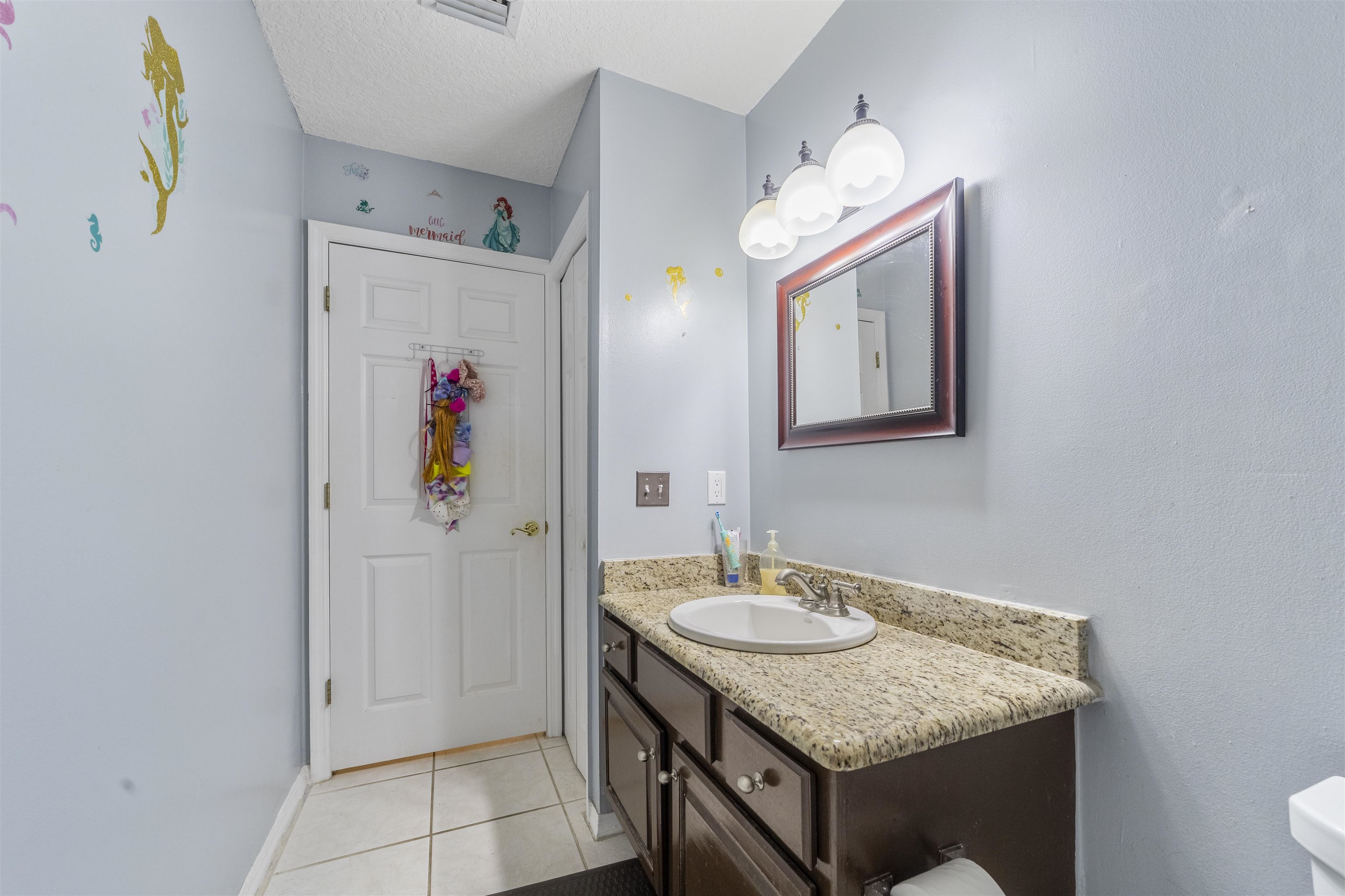 311 Graciela Circle St. Augustine, FL 32086 - Photo 49 of 65 Bathroom with light tile patterned floors and vanity