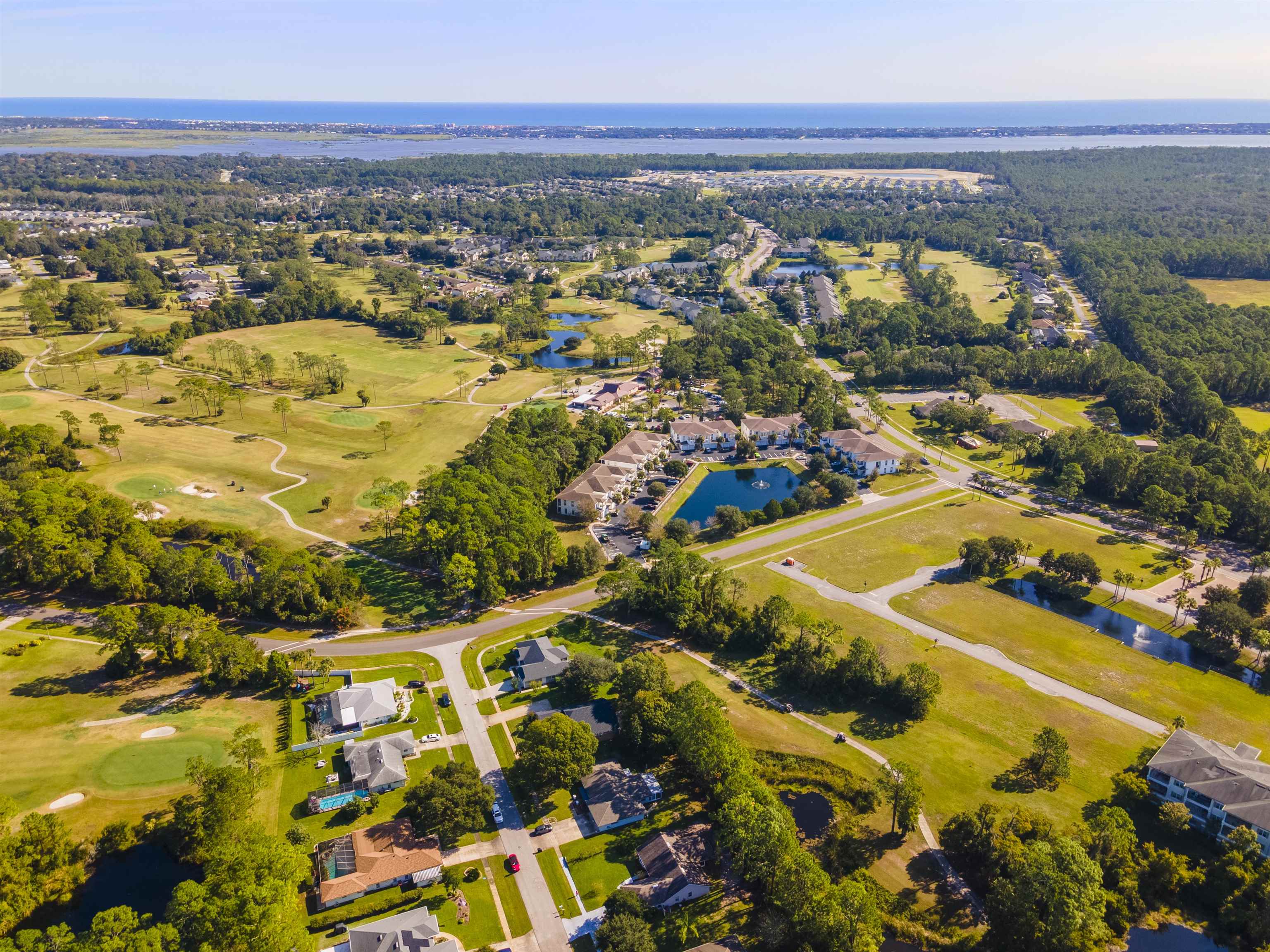 311 Graciela Circle St. Augustine, FL 32086 - Photo 5 of 65 Aerial overview of property's location with a nearby body of water, nearby suburban area, and a local golf course
