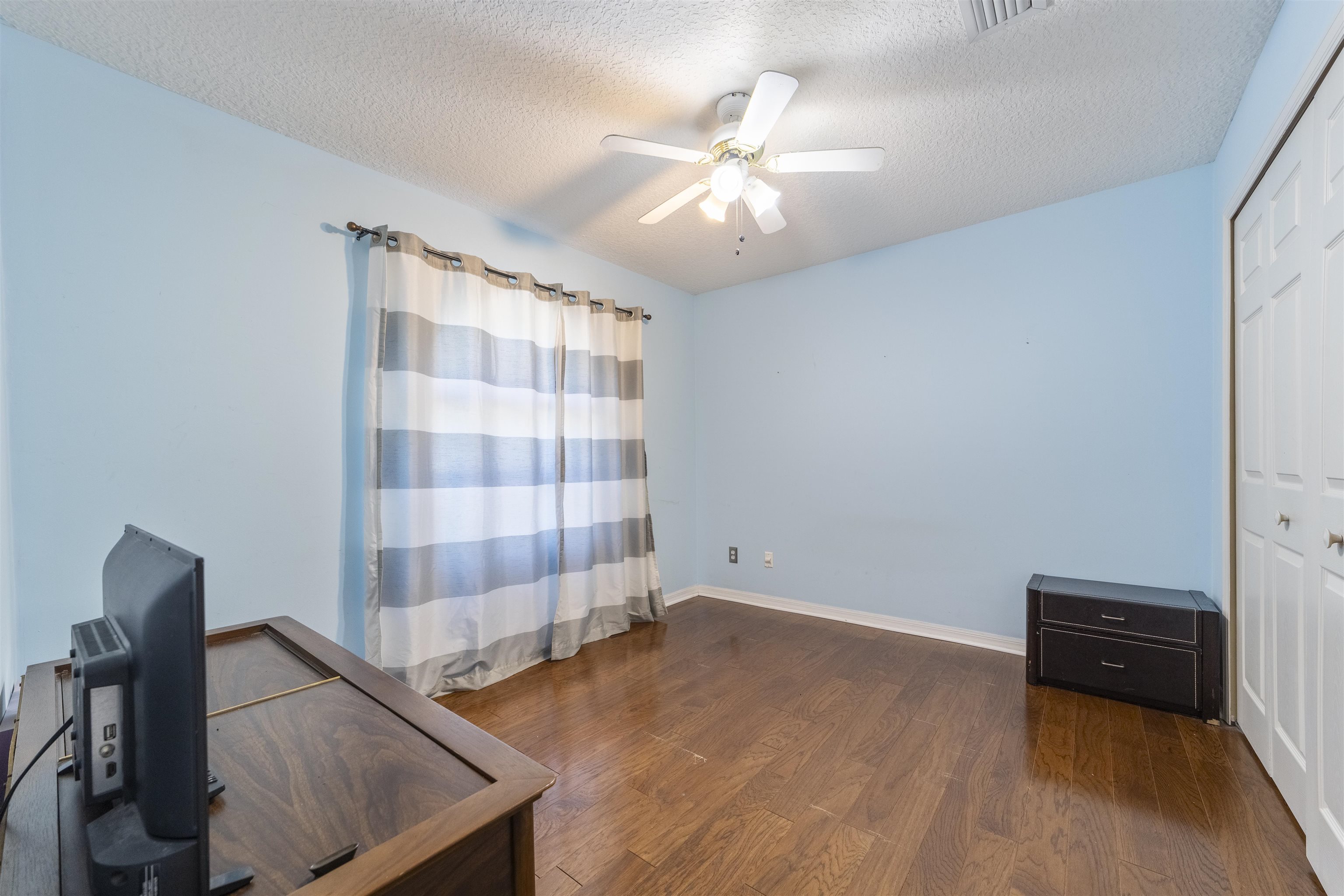 311 Graciela Circle St. Augustine, FL 32086 - Photo 55 of 65 Office area featuring dark wood-style floors, a textured ceiling, and ceiling fan