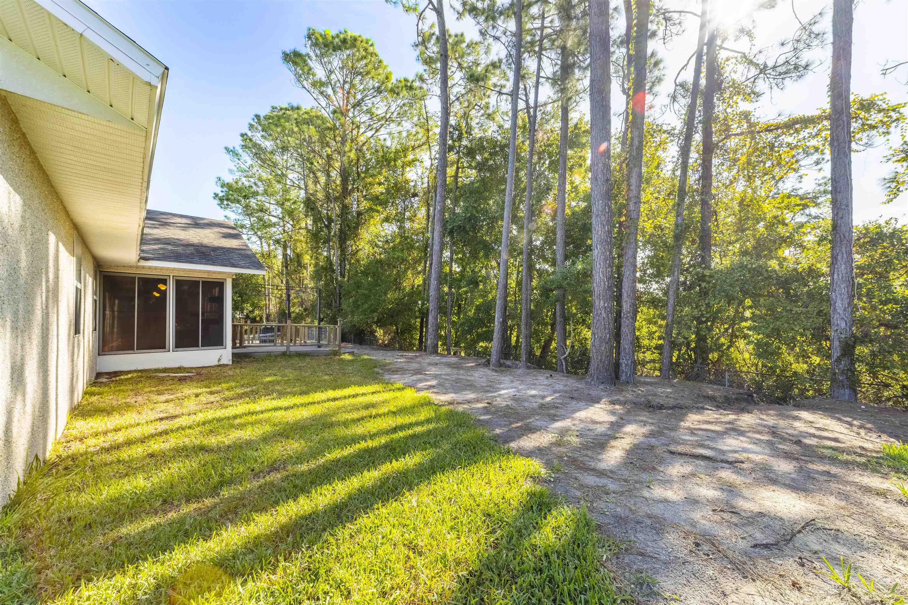 311 Graciela Circle St. Augustine, FL 32086 - Photo 60 of 65 View of green lawn featuring a sunroom
