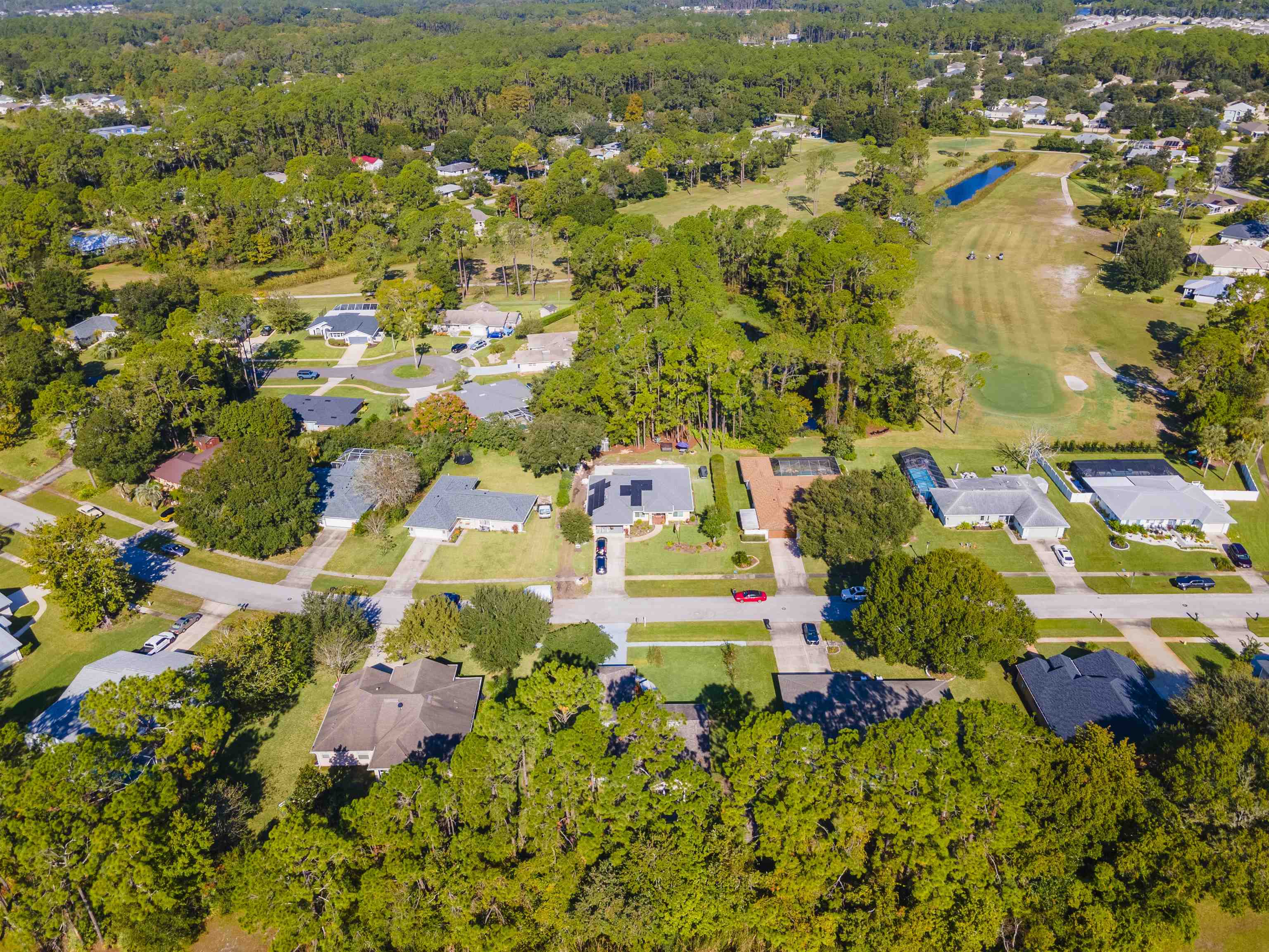 311 Graciela Circle St. Augustine, FL 32086 - Photo 6 of 65 Aerial overview of property's location featuring nearby suburban area, a large body of water, and a golf course