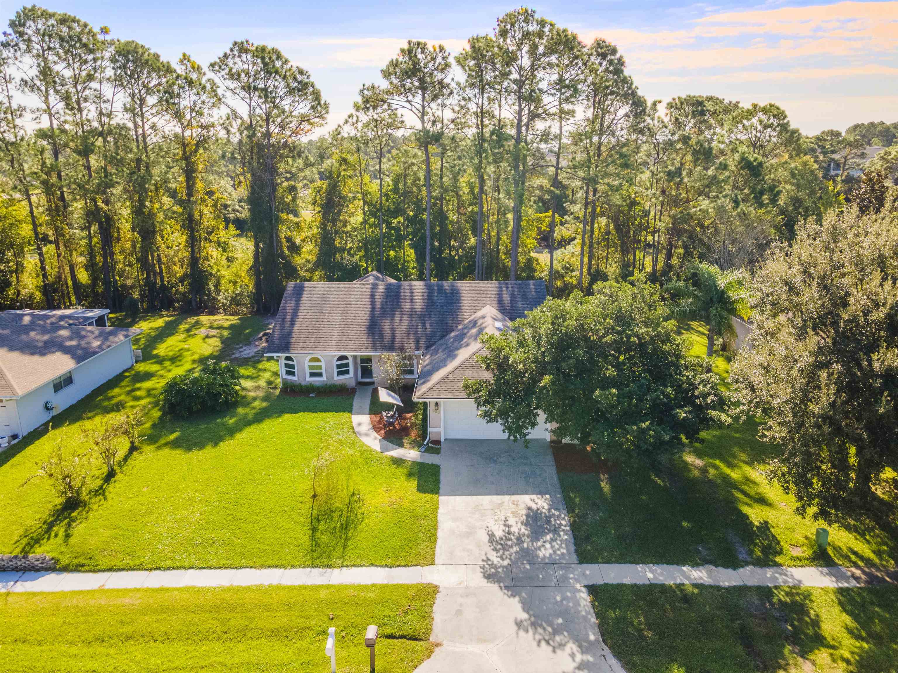 311 Graciela Circle St. Augustine, FL 32086 - Photo 63 of 65 Aerial view of property and surrounding area with a forest