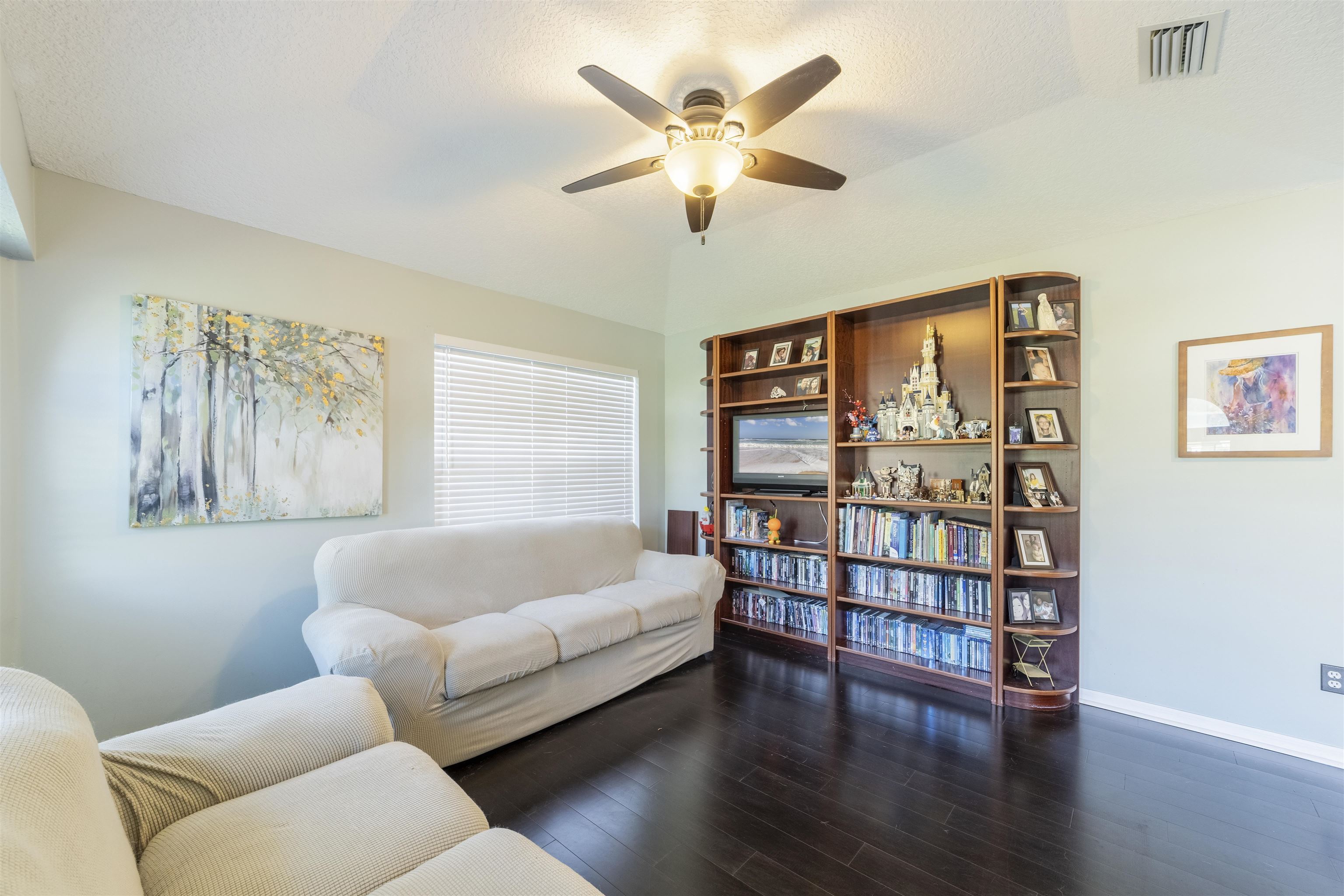 311 Graciela Circle St. Augustine, FL 32086 - Photo 8 of 65 Living room with a ceiling fan, dark wood-type flooring, and a textured ceiling