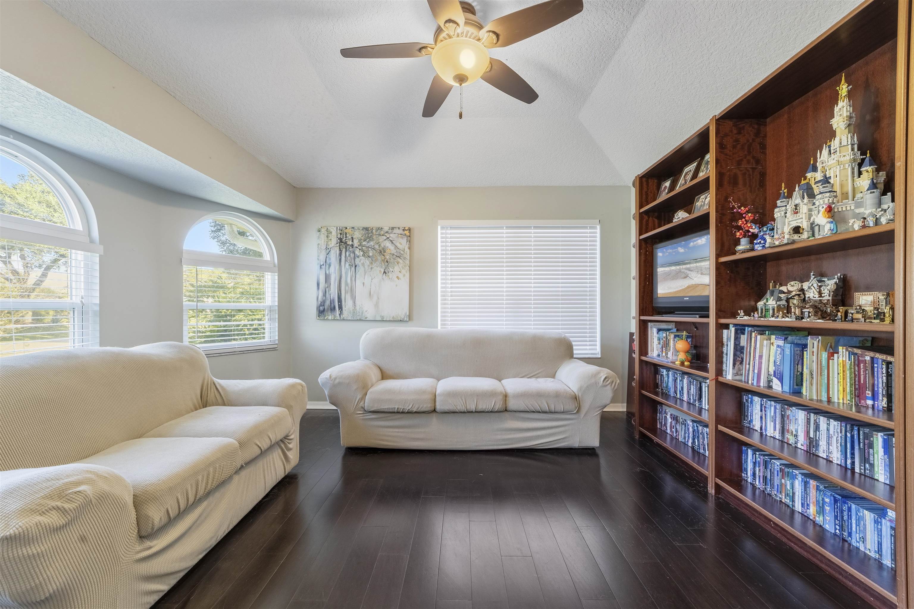 311 Graciela Circle St. Augustine, FL 32086 - Photo 10 of 65 Sitting room featuring dark wood-style flooring, ceiling fan, vaulted ceiling, and a textured ceiling