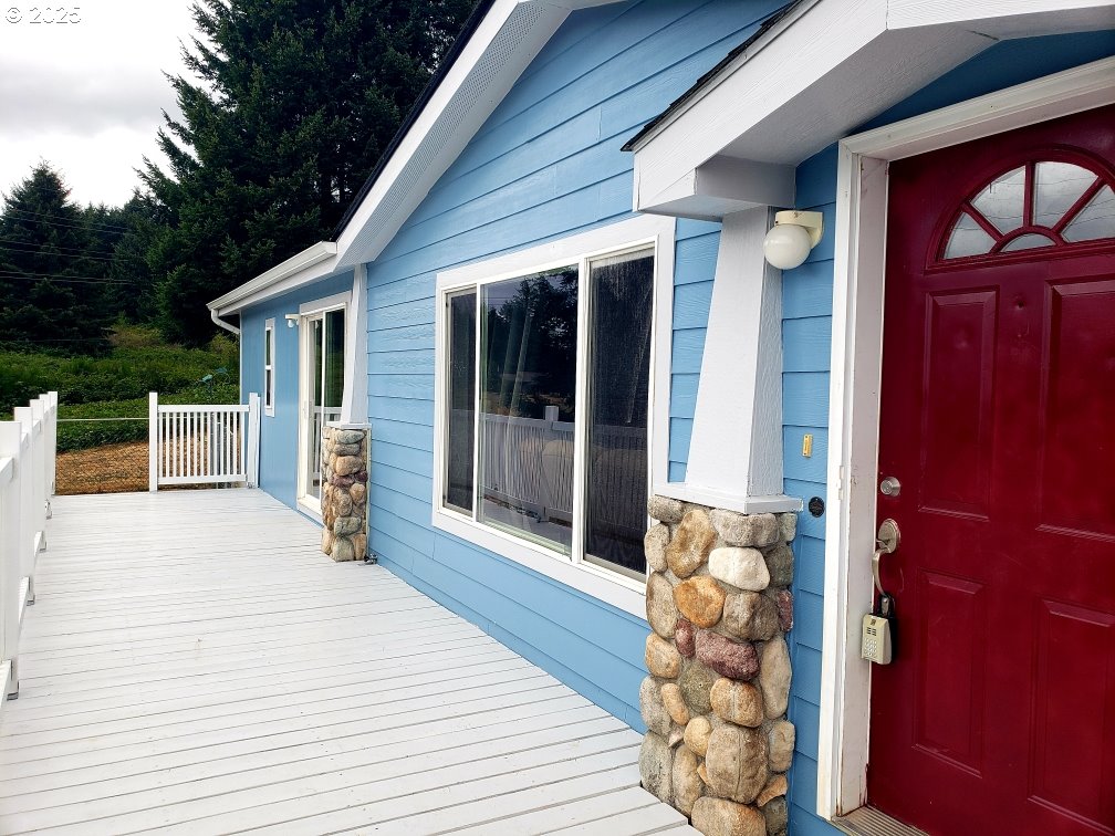 661 D Street Elkton, OR 97436 - Photo 1 of 28 a view of a patio with table and chairs and wooden floor