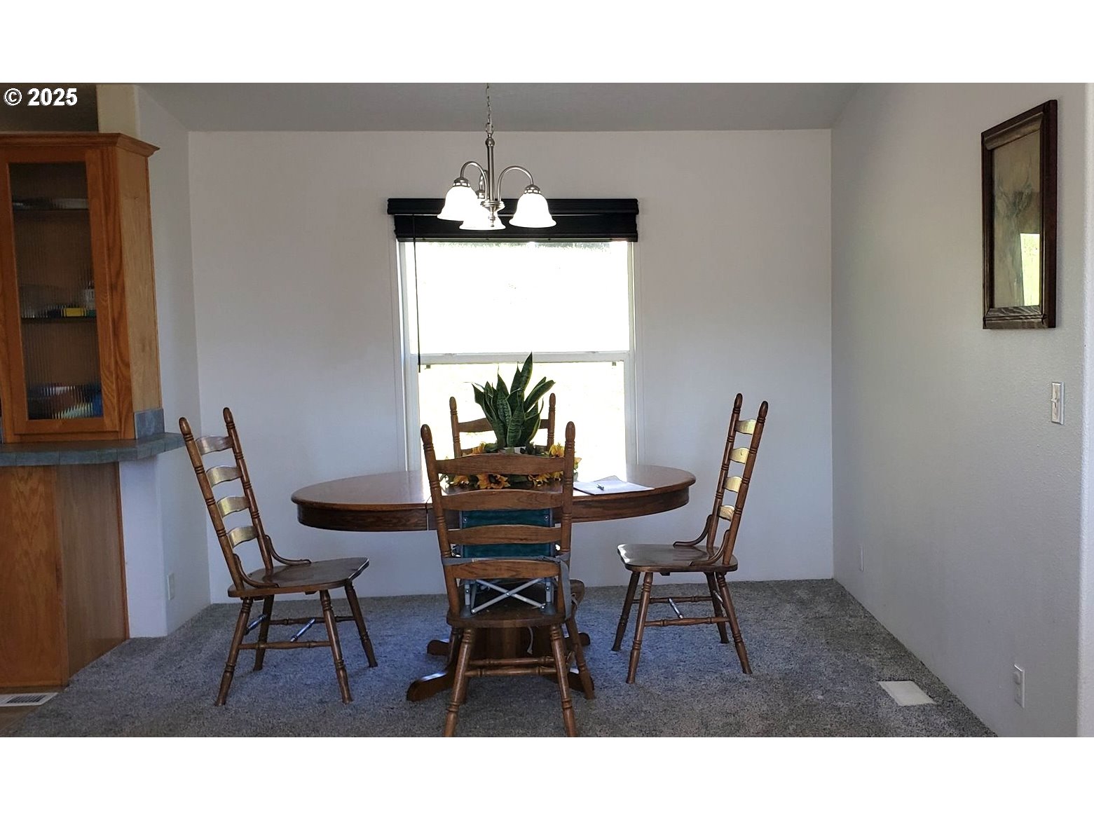 661 D Street Elkton, OR 97436 - Photo 11 of 28 a view of a dining room with furniture and chandelier