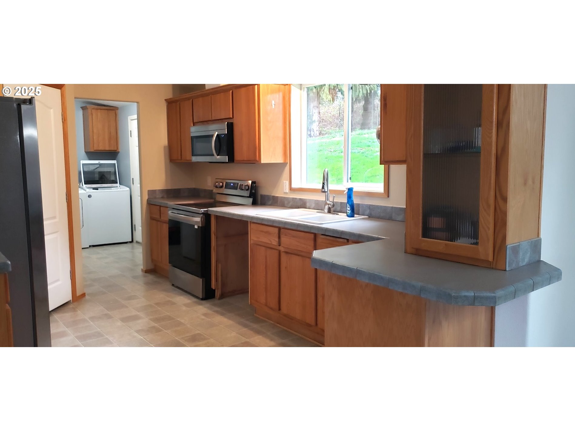 661 D Street Elkton, OR 97436 - Photo 8 of 28 a kitchen with stainless steel appliances granite countertop a sink stove and refrigerator