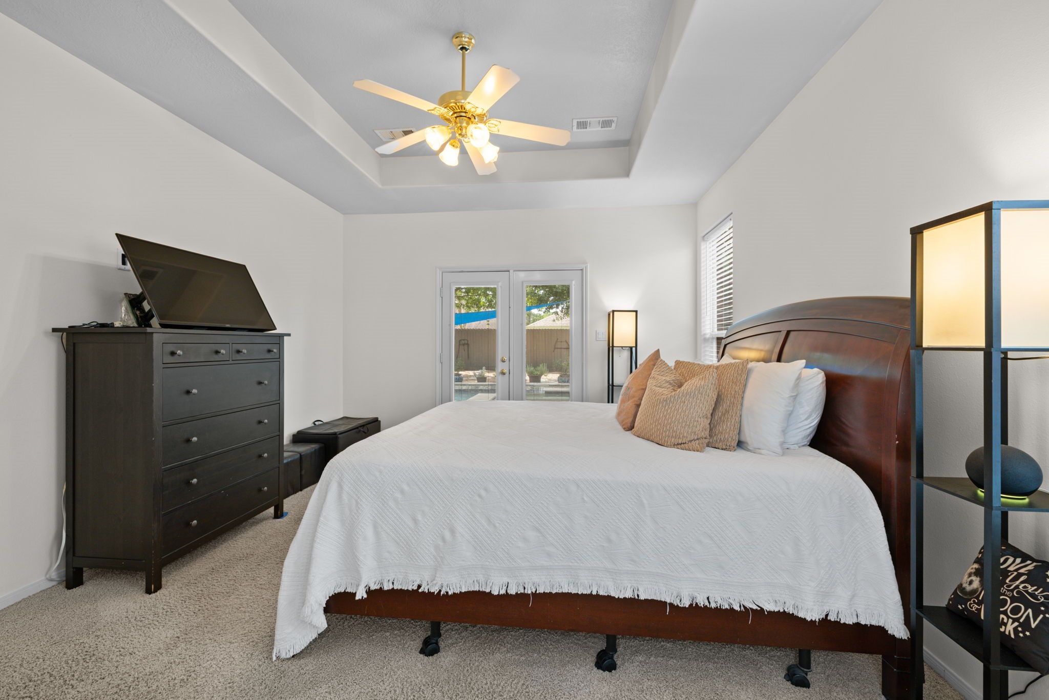 19114 Emory Trail Spring, TX 77388 - Photo 22 of 44 a bedroom with a bed and a chandelier