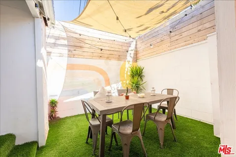 a view of an outdoor dining space with furniture