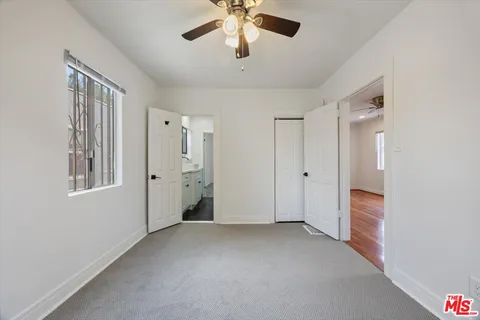 a view of empty room with ceiling fan