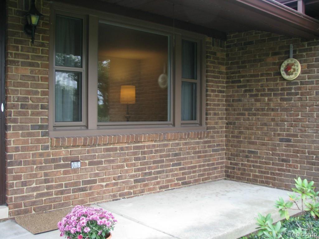9334 Hilton Road Brighton, MI 48114 - Photo 30 of 34 Close up view front covered porch , window front living room view