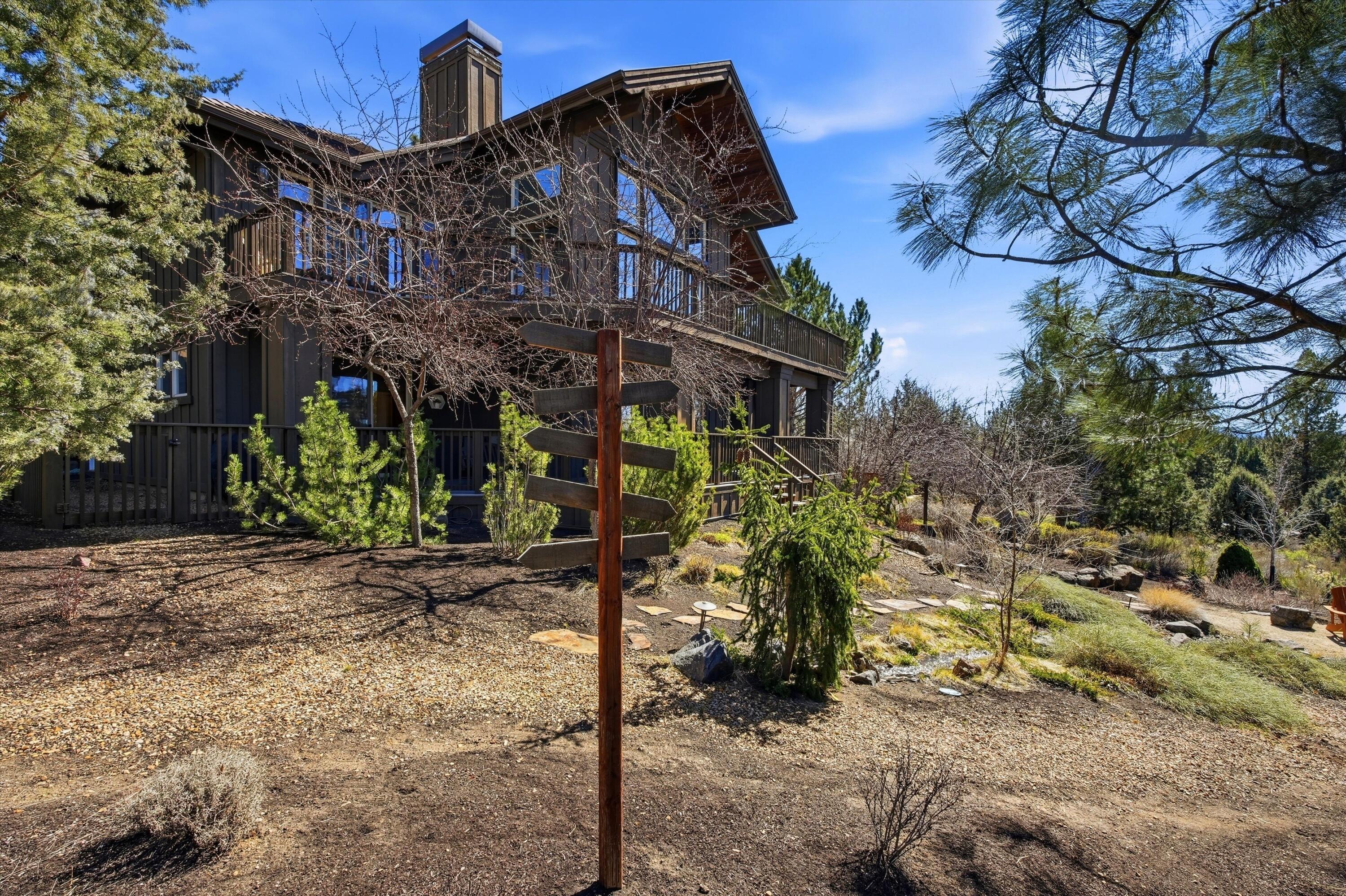 15 Southwest Quail Butte Place Bend, OR 97703 - Photo 1 of 55 a view of a house with a tree