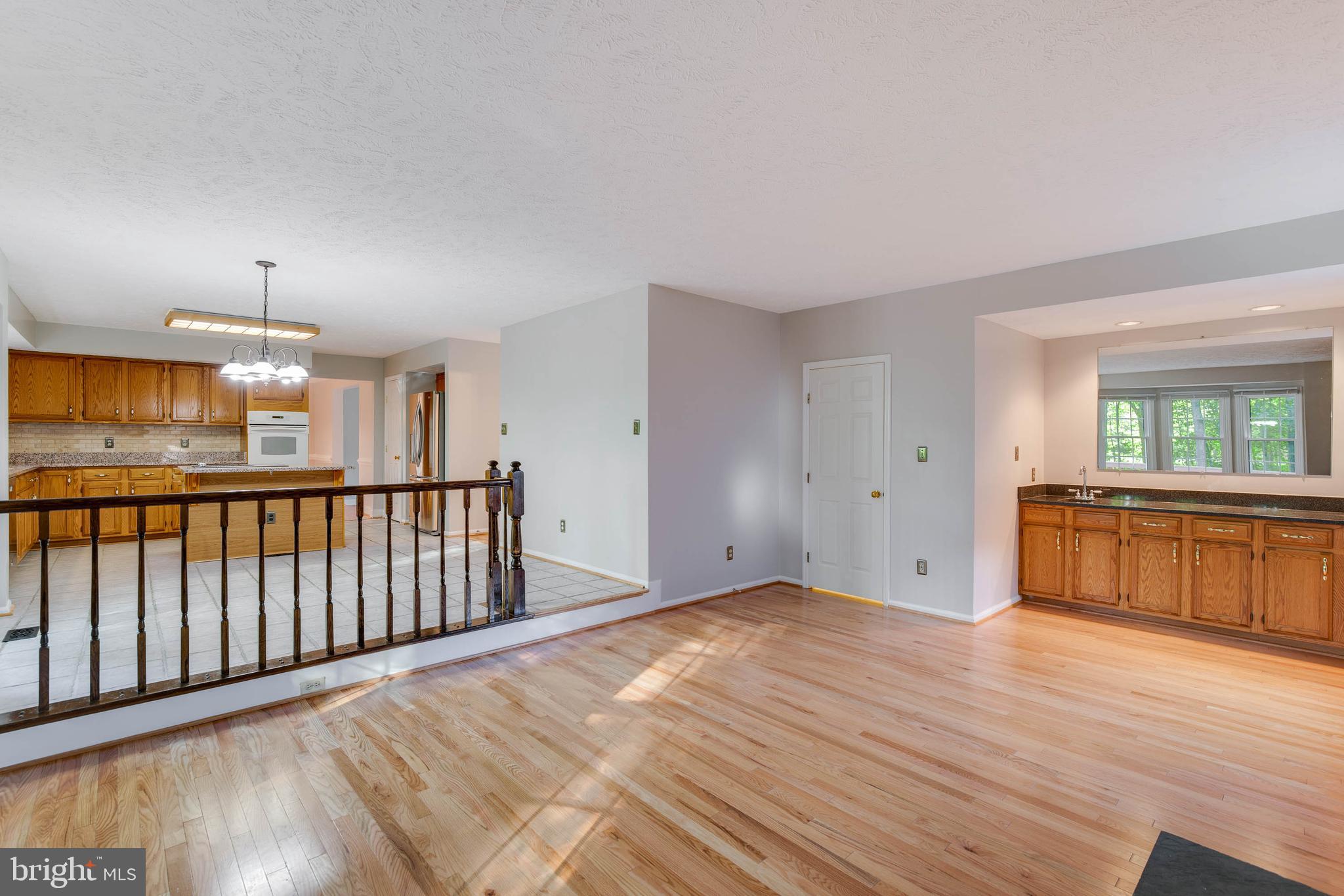 2332 Club Pond Lane Reston, VA 20191 - Photo 10 of 39 Family Room Opens to Kitchen with Wet Bar