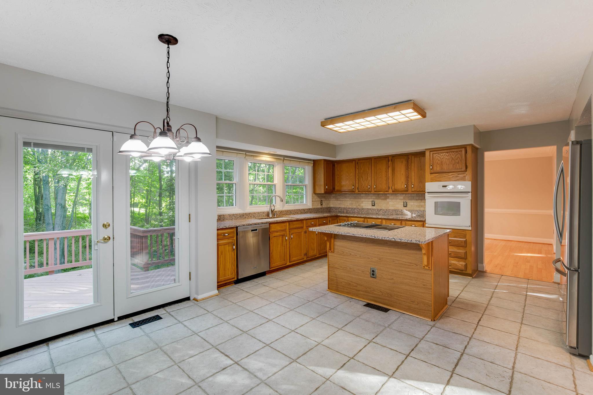 2332 Club Pond Lane Reston, VA 20191 - Photo 12 of 39 Kitchen Opens to Spacious Deck Shaded with Trees!