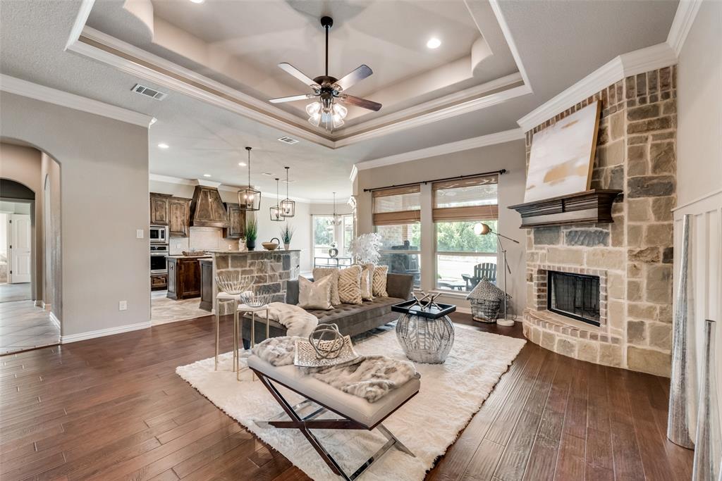152 Spring Meadow Drive Springtown, TX 76082 - Photo 1 of 1 a living room with furniture fireplace and a large window