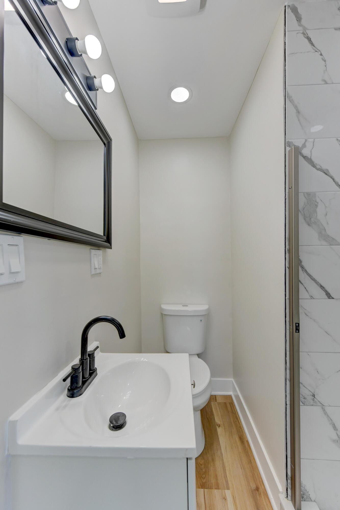 824 Elm Street Valparaiso, IN 46383 - Photo 11 of 20 a bathroom with a sink and a mirror