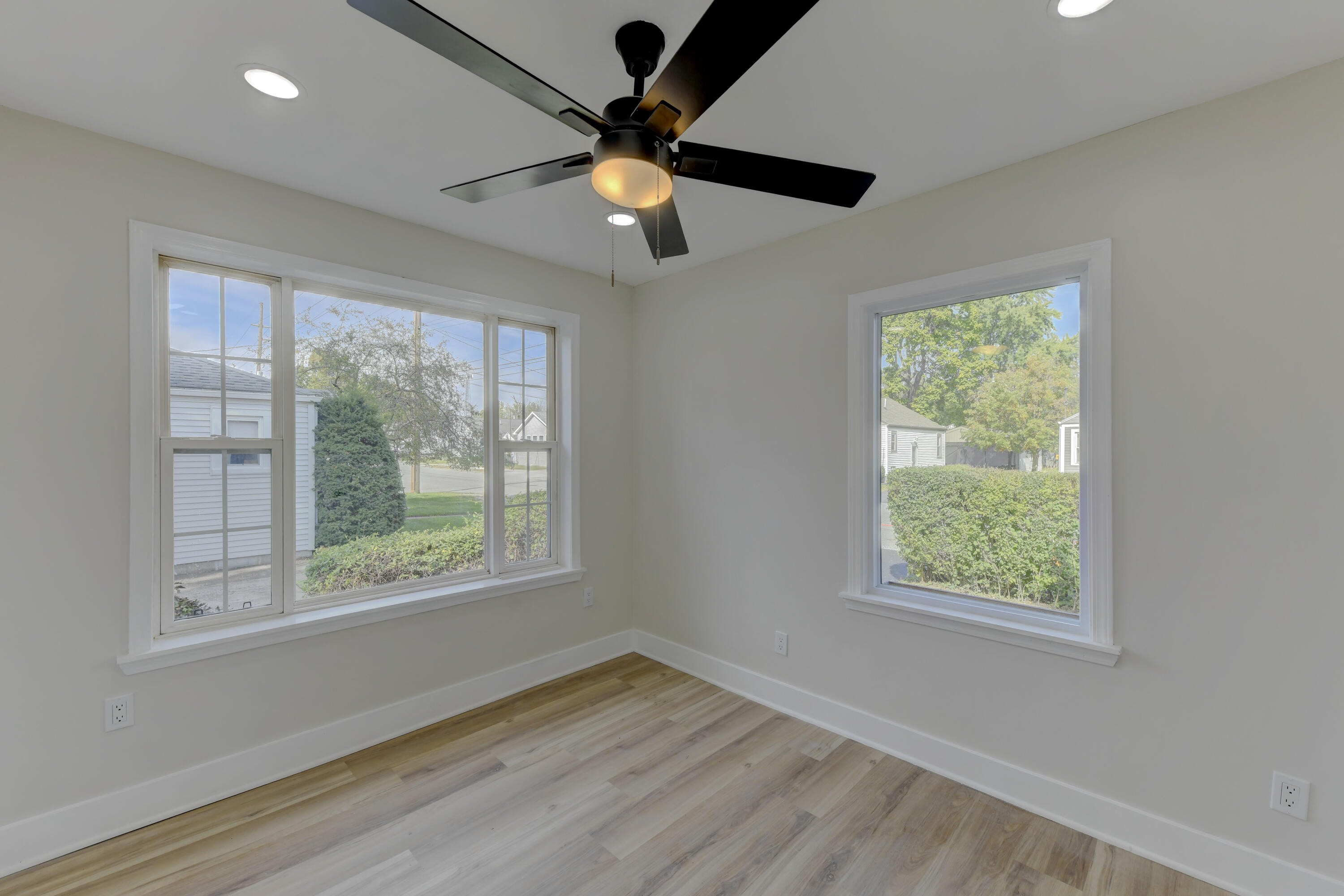 824 Elm Street Valparaiso, IN 46383 - Photo 13 of 20 a view of an empty room with wooden floor and a window