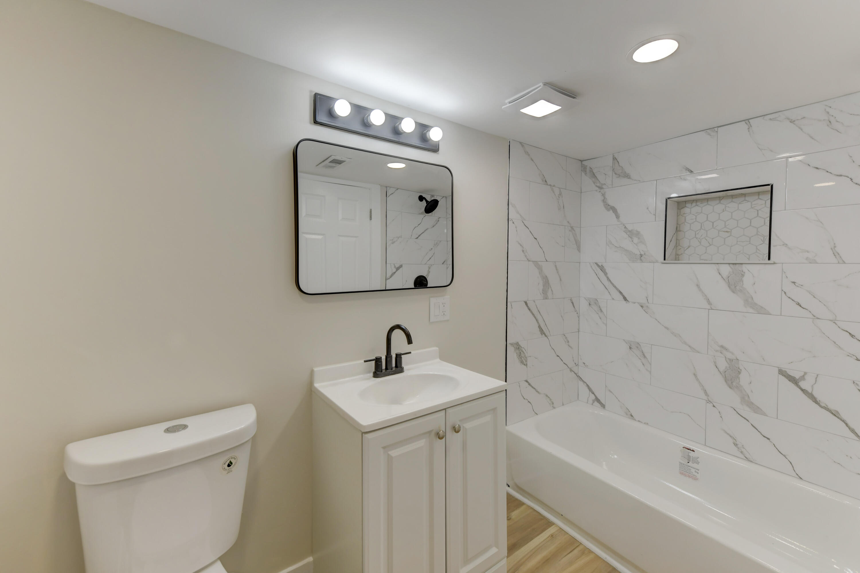824 Elm Street Valparaiso, IN 46383 - Photo 15 of 20 a bathroom with a toilet sink and mirror