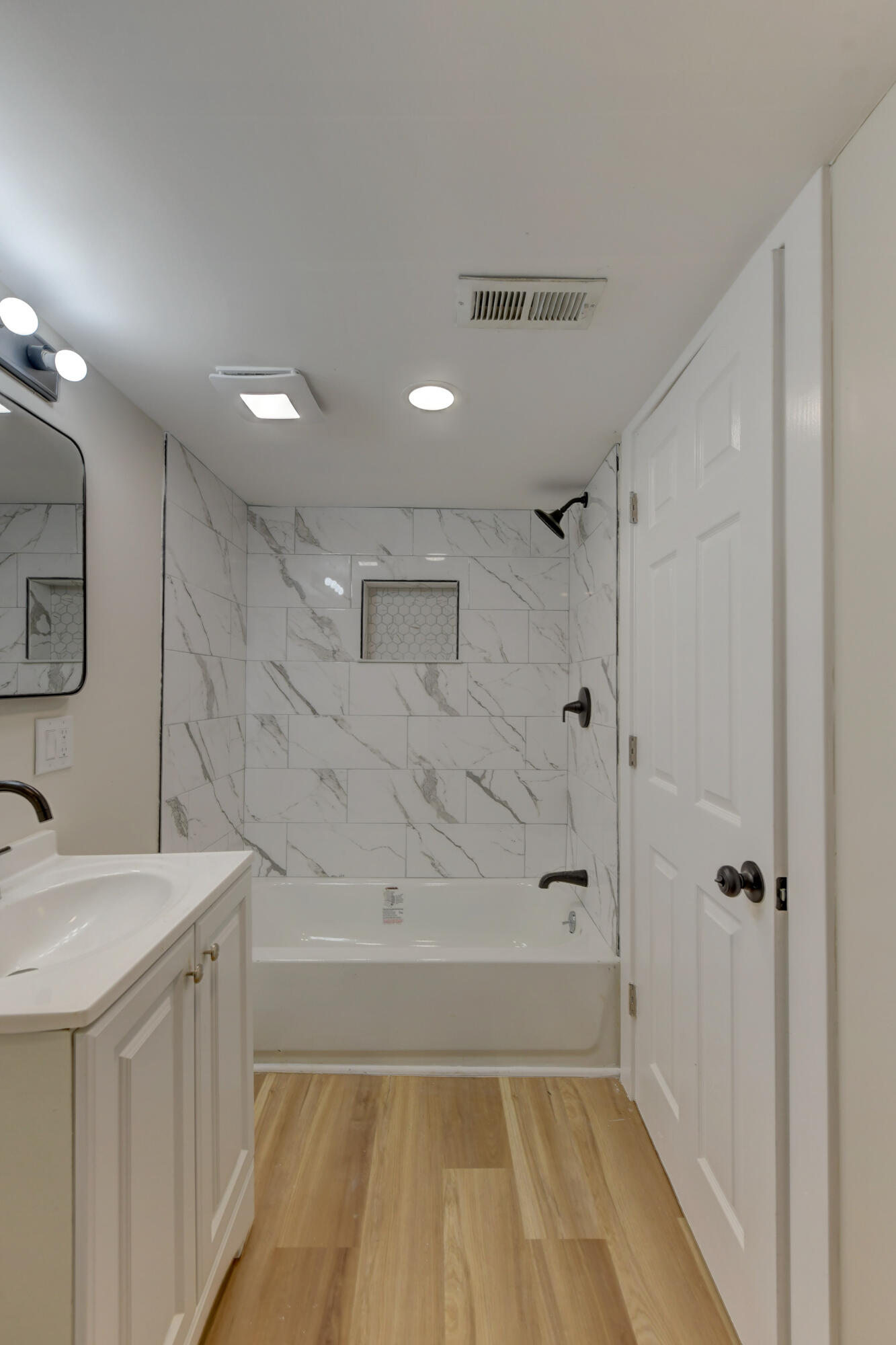 824 Elm Street Valparaiso, IN 46383 - Photo 16 of 20 a bathroom with a bathtub a shower a sink and vanity