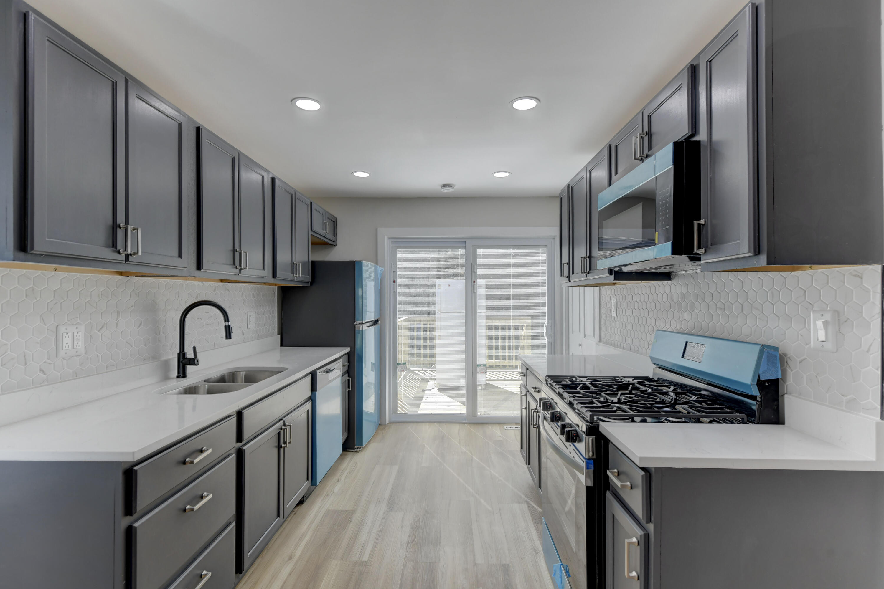 824 Elm Street Valparaiso, IN 46383 - Photo 6 of 20 a kitchen with stainless steel appliances granite countertop a stove top oven a sink dishwasher and a refrigerator with wooden cabinets