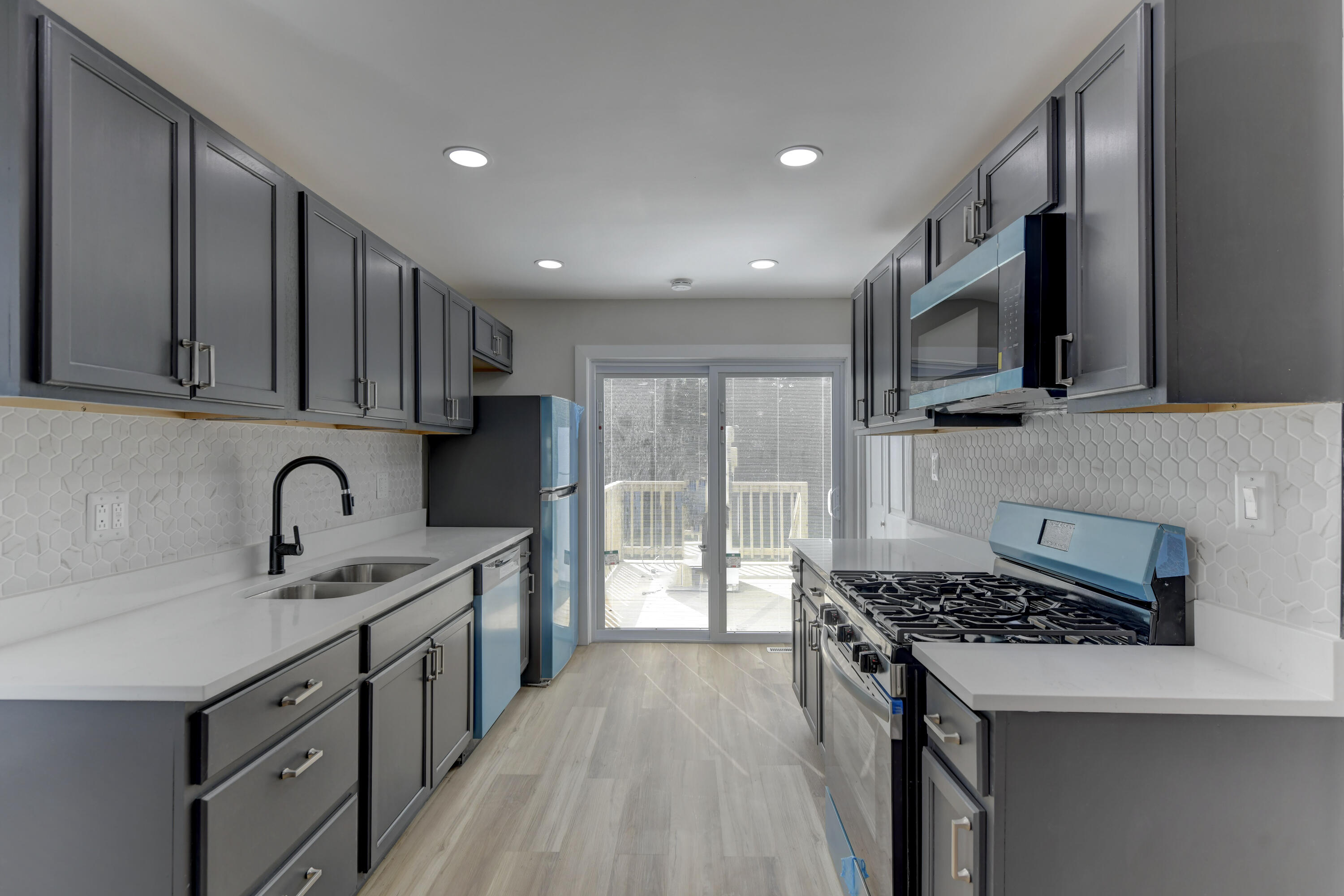 824 Elm Street Valparaiso, IN 46383 - Photo 7 of 20 a kitchen with stainless steel appliances granite countertop a stove top oven a sink dishwasher and a refrigerator with wooden cabinets