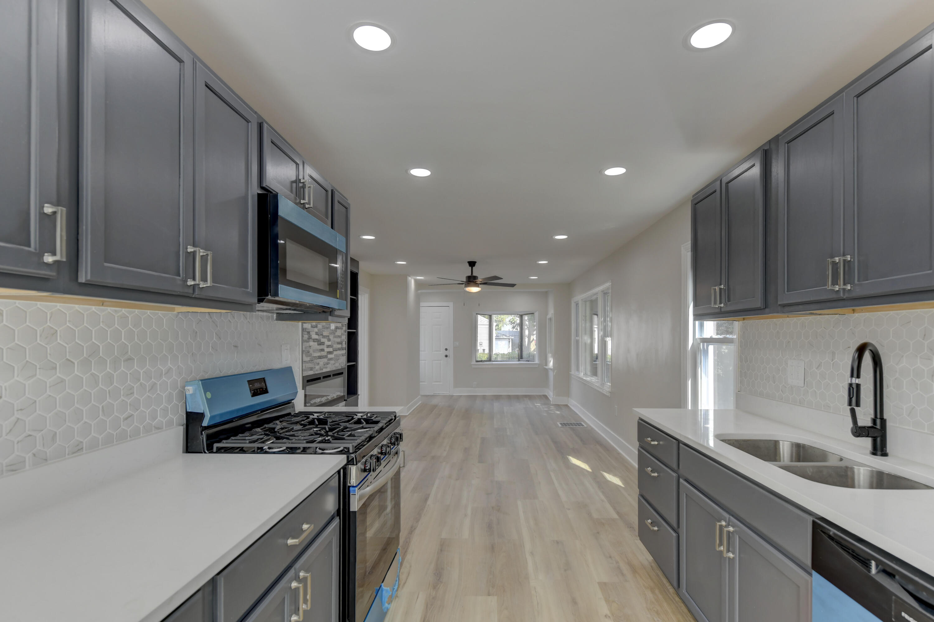 824 Elm Street Valparaiso, IN 46383 - Photo 8 of 20 a kitchen with stainless steel appliances granite countertop a sink stove and refrigerator