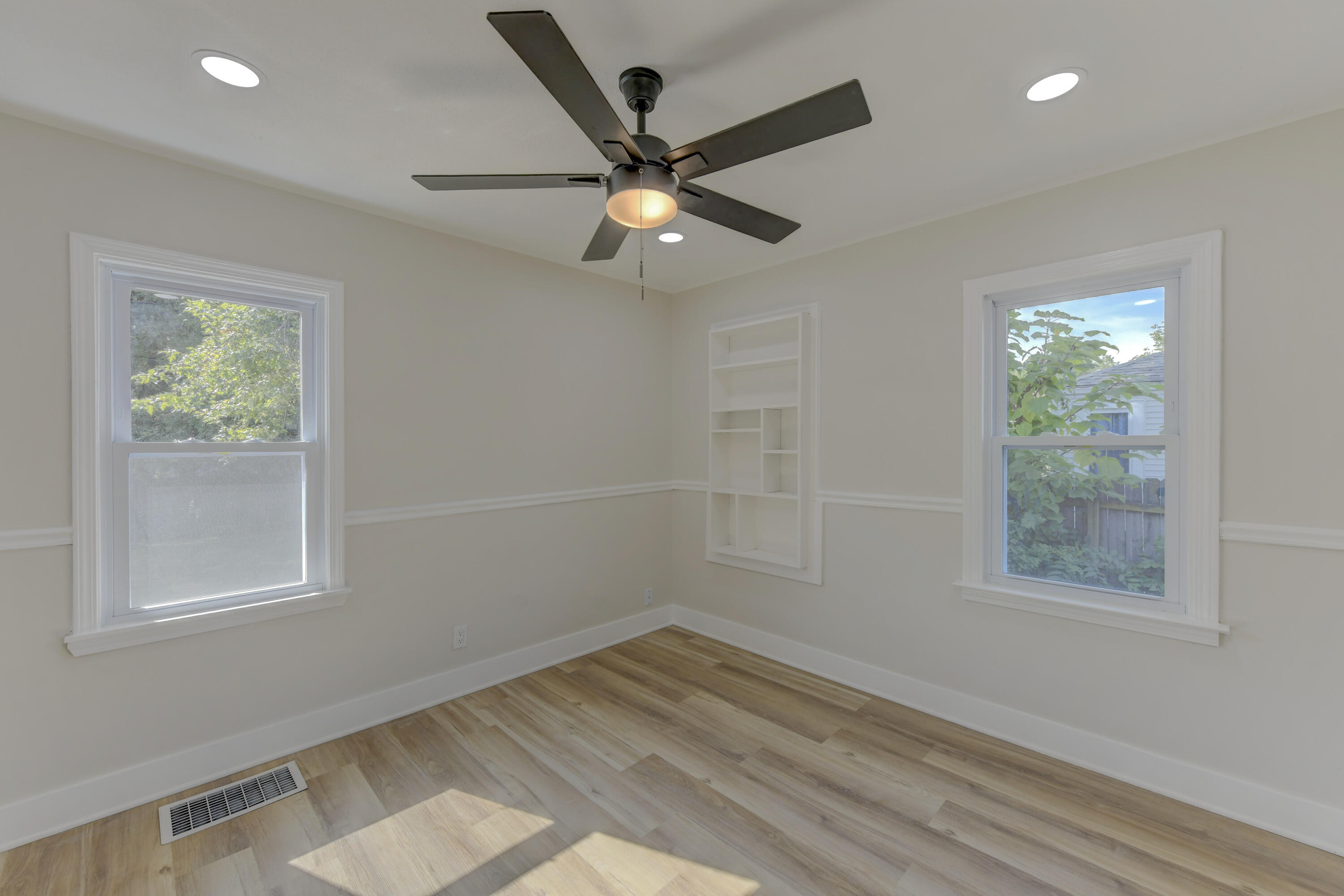 824 Elm Street Valparaiso, IN 46383 - Photo 10 of 20 a view of empty room with wooden floor and fan