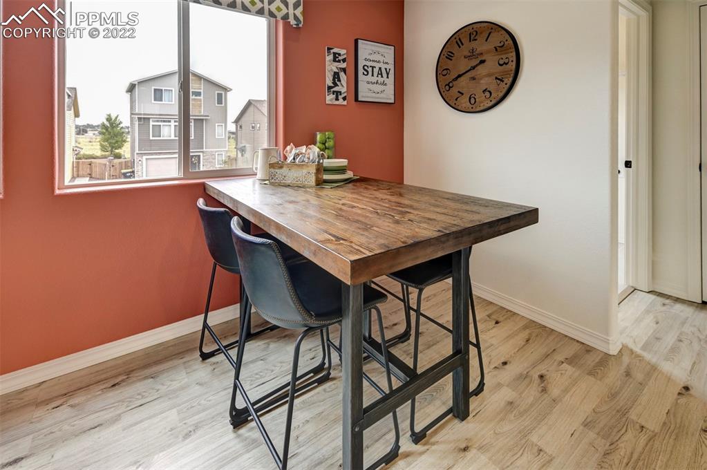4456 Samaritan Loop Colorado Springs, CO 80916 - Photo 9 of 25 a view of a table and chairs in a room