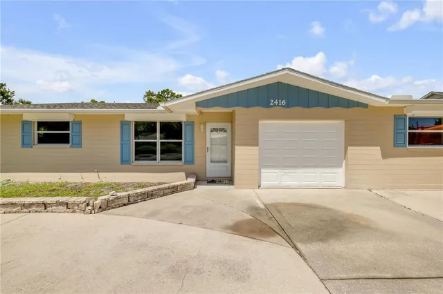 a view of backyard with a garden and plants