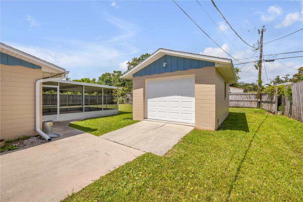 2416 Pine Tree Drive Edgewater, FL 32141 - Photo 12 of 50 a view of backyard with a garden and plants