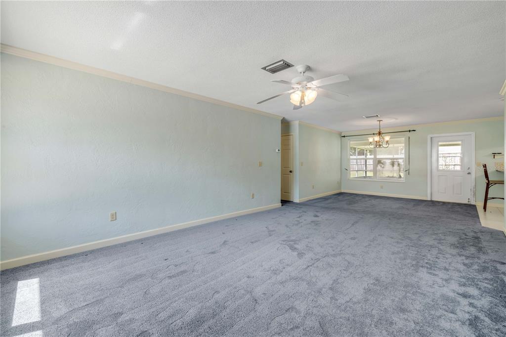 2416 Pine Tree Drive Edgewater, FL 32141 - Photo 15 of 50 a view of an empty room with a window