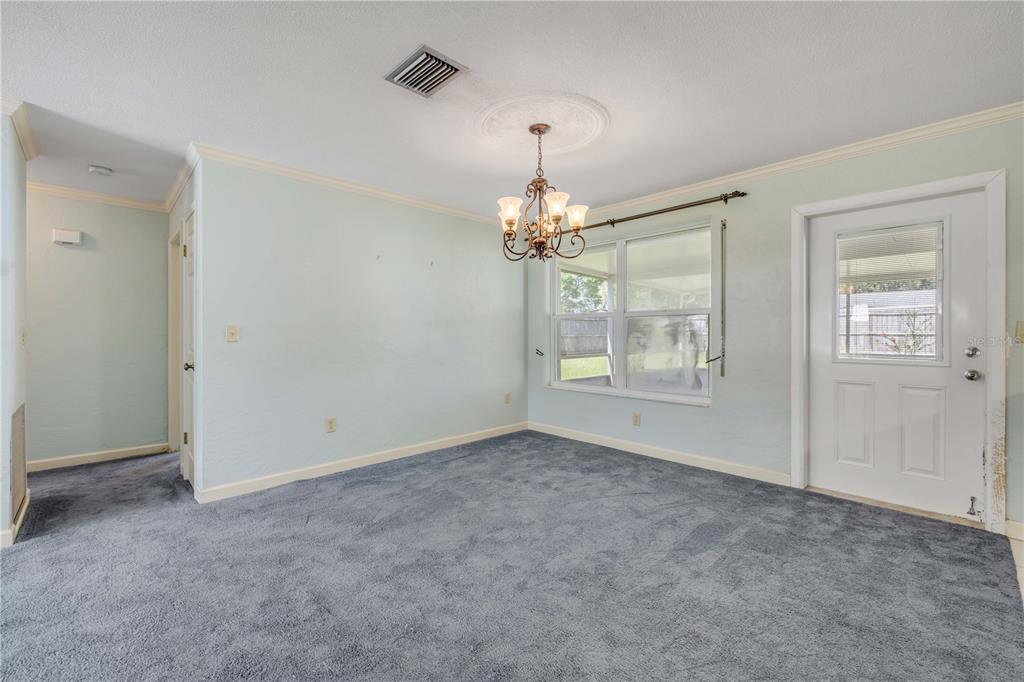 2416 Pine Tree Drive Edgewater, FL 32141 - Photo 19 of 50 a view of an empty room with a window