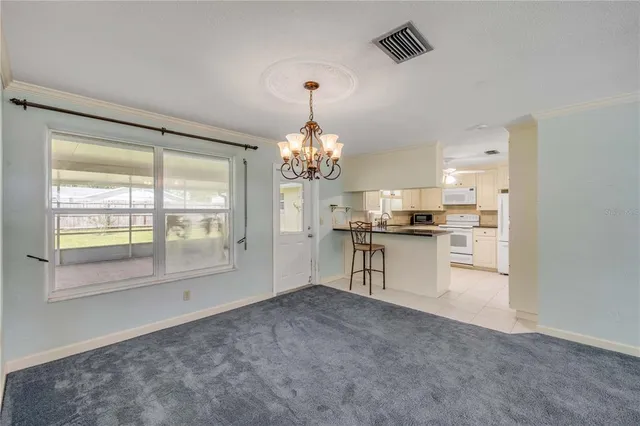 a view of livingroom with kitchen and dining area