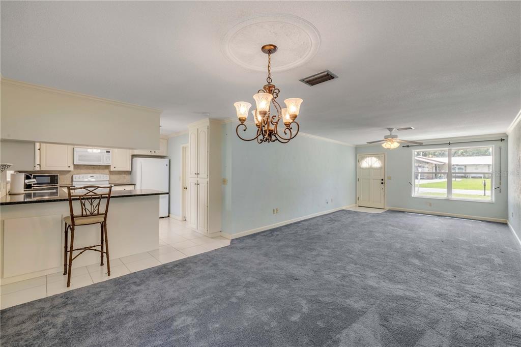 2416 Pine Tree Drive Edgewater, FL 32141 - Photo 21 of 50 a view of livingroom with kitchen and dining area