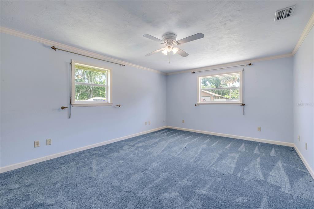2416 Pine Tree Drive Edgewater, FL 32141 - Photo 35 of 50 a view of an empty room with a window
