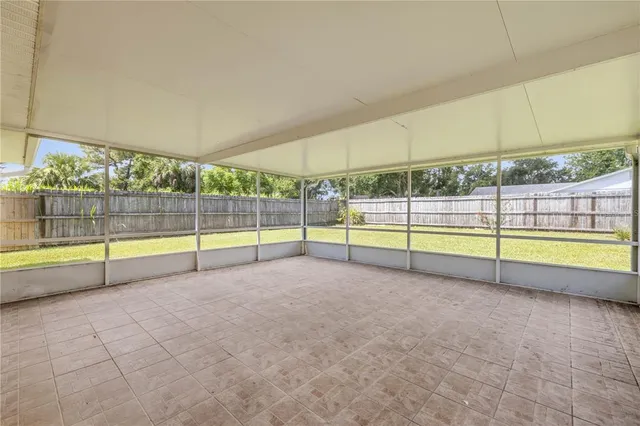 a view of an empty room with glass door