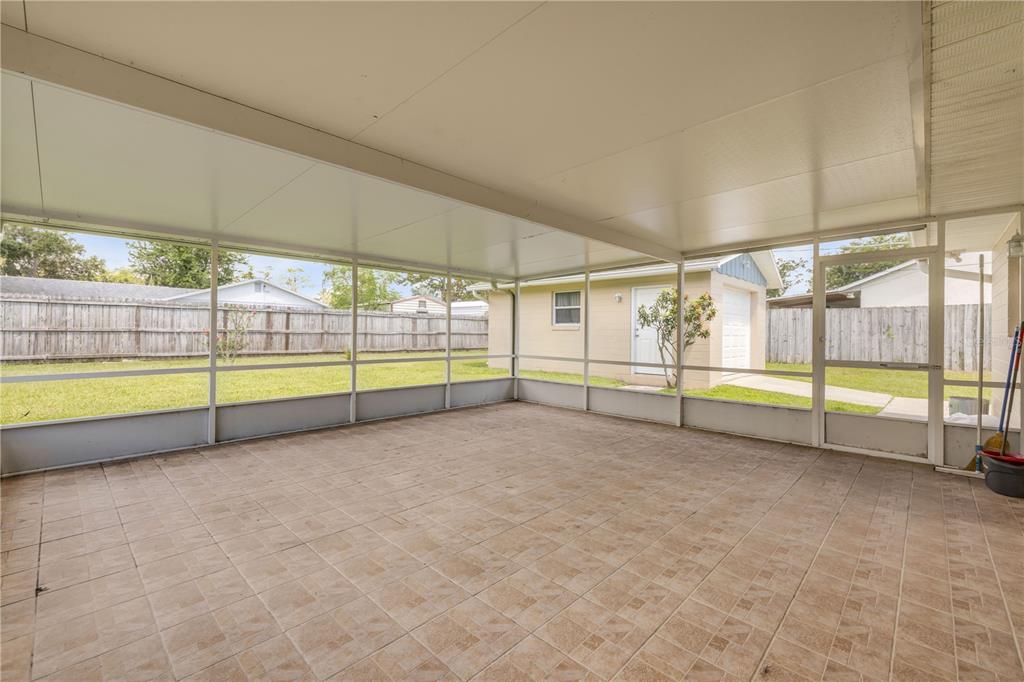2416 Pine Tree Drive Edgewater, FL 32141 - Photo 39 of 50 a view of an empty room with glass door