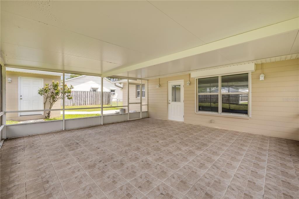 2416 Pine Tree Drive Edgewater, FL 32141 - Photo 40 of 50 a view of an empty room with a window