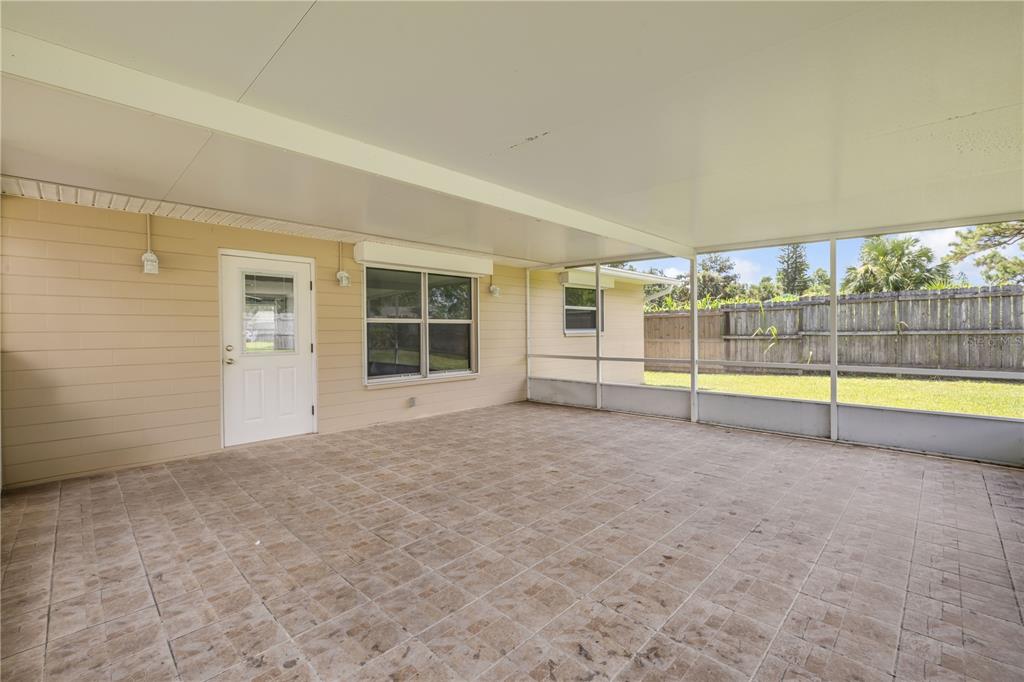 2416 Pine Tree Drive Edgewater, FL 32141 - Photo 41 of 50 a view of an empty room with glass door