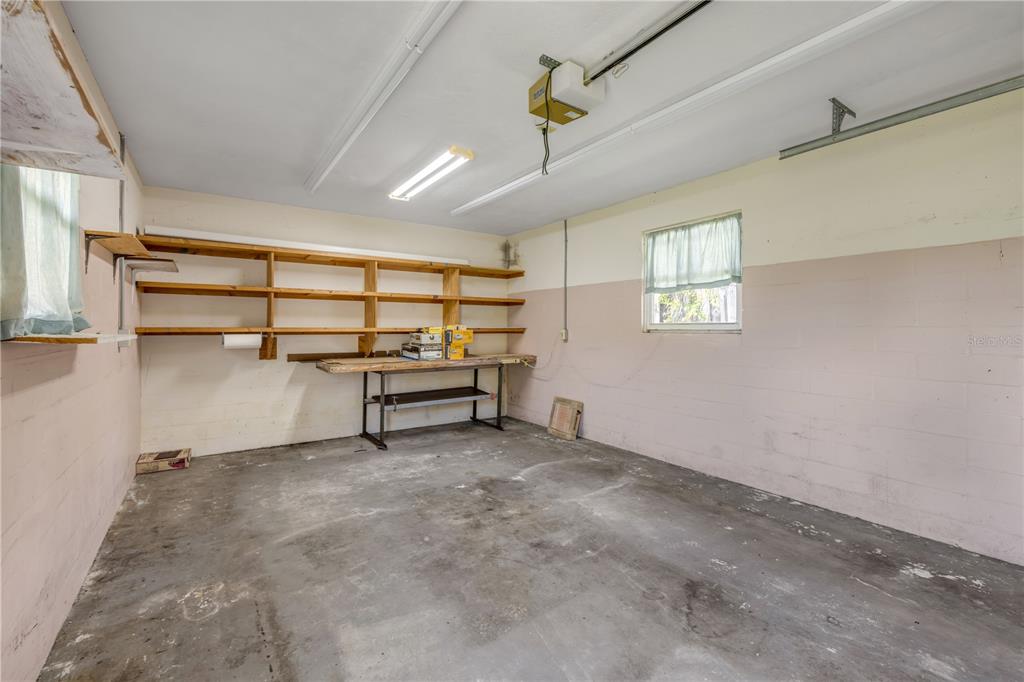 2416 Pine Tree Drive Edgewater, FL 32141 - Photo 42 of 50 a view of an empty room with a window