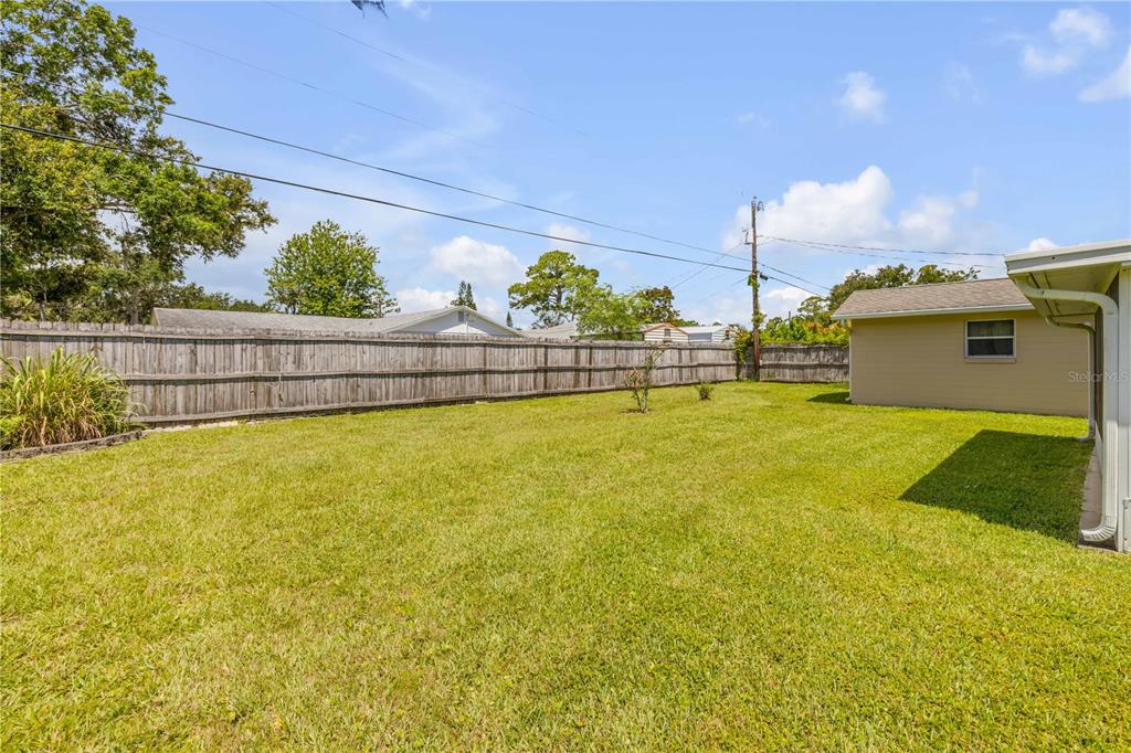 2416 Pine Tree Drive Edgewater, FL 32141 - Photo 46 of 50 a view of a swimming pool with an ocean view