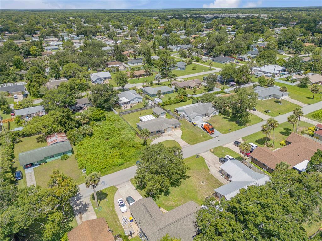 2416 Pine Tree Drive Edgewater, FL 32141 - Photo 47 of 50 an aerial view of residential houses with outdoor space