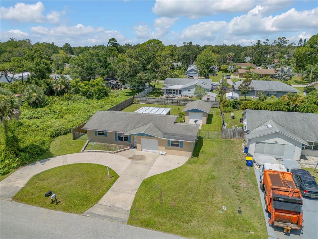 2416 Pine Tree Drive Edgewater, FL 32141 - Photo 6 of 50 an aerial view of a swimming pool with outdoor seating
