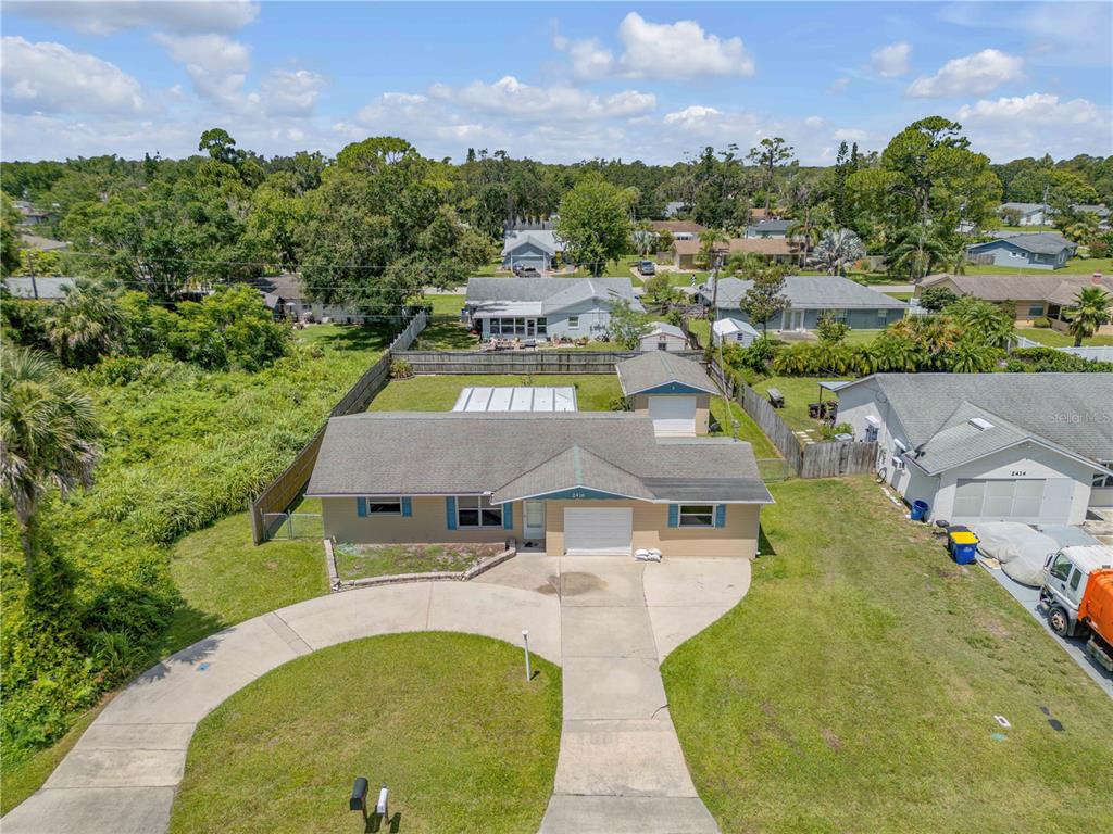 2416 Pine Tree Drive Edgewater, FL 32141 - Photo 7 of 50 an aerial view of a house with yard swimming pool and outdoor seating