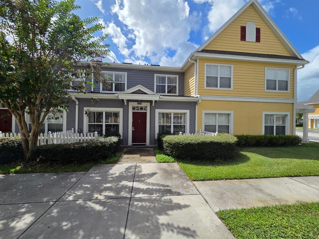 4600 Yellowgold Road West, Unit 106 Kissimmee, FL 34746 - Photo 1 of 25 a front view of a house with a garden