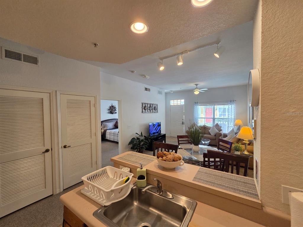 4600 Yellowgold Road West, Unit 106 Kissimmee, FL 34746 - Photo 4 of 25 a living room with furniture