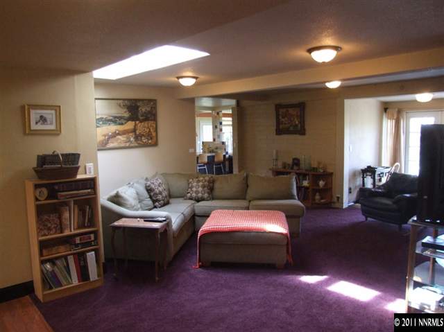 15165 Kivett Lane Reno, NV 89521 - Photo 3 of 12 a bedroom with furniture and a book shelf
