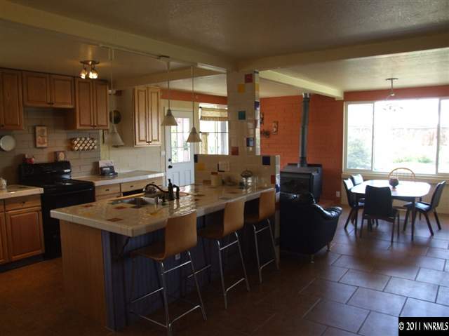 15165 Kivett Lane Reno, NV 89521 - Photo 5 of 12 a kitchen with lots of counter top space