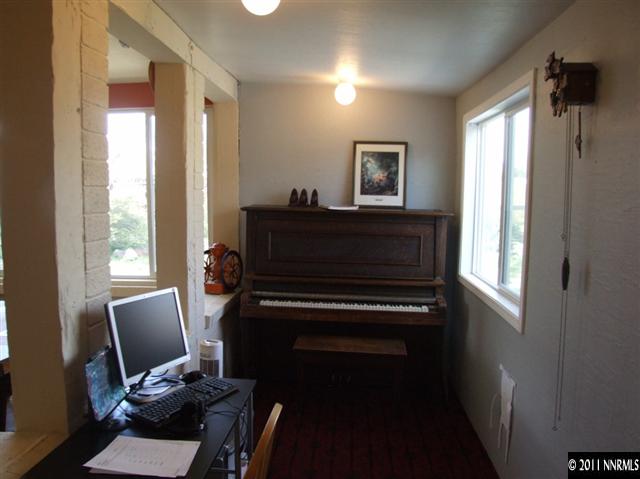 15165 Kivett Lane Reno, NV 89521 - Photo 7 of 12 a view of a workspace with furniture and a window