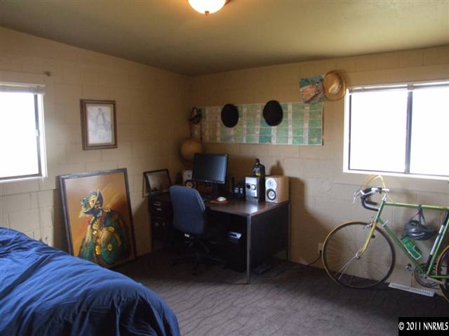 15165 Kivett Lane Reno, NV 89521 - Photo 10 of 12 a bed room with a bed and a table